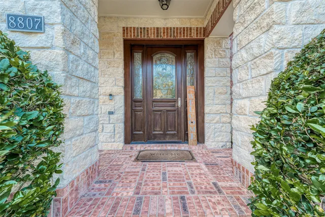an entrance to house with yard