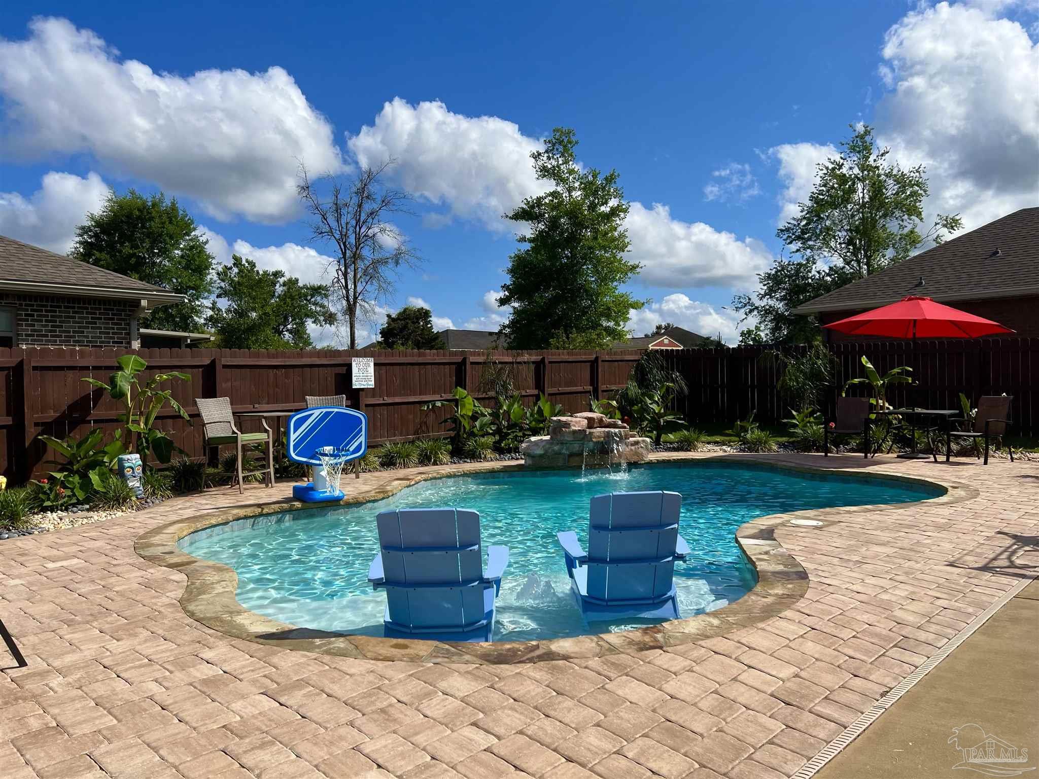 a view of a swimming pool with a patio