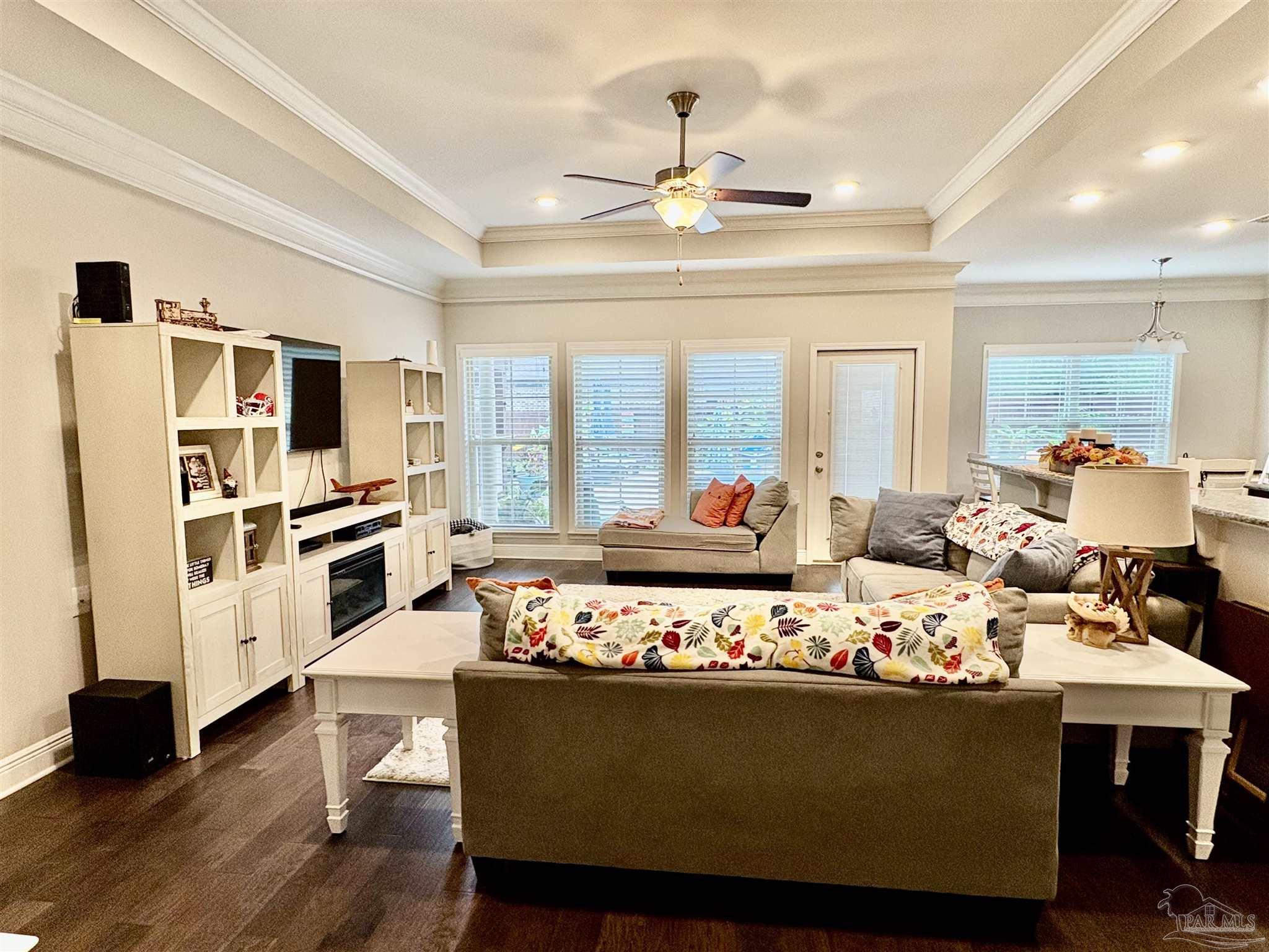 1700 Kahuna Way Cantonment, FL 32533 - Photo 17 of 34 a living room with furniture and flat screen tv