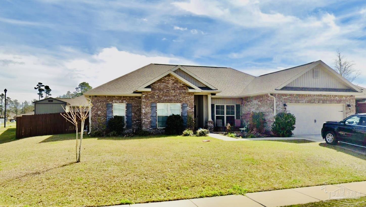 1700 Kahuna Way Cantonment, FL 32533 - Photo 2 of 34 a front view of house with yard