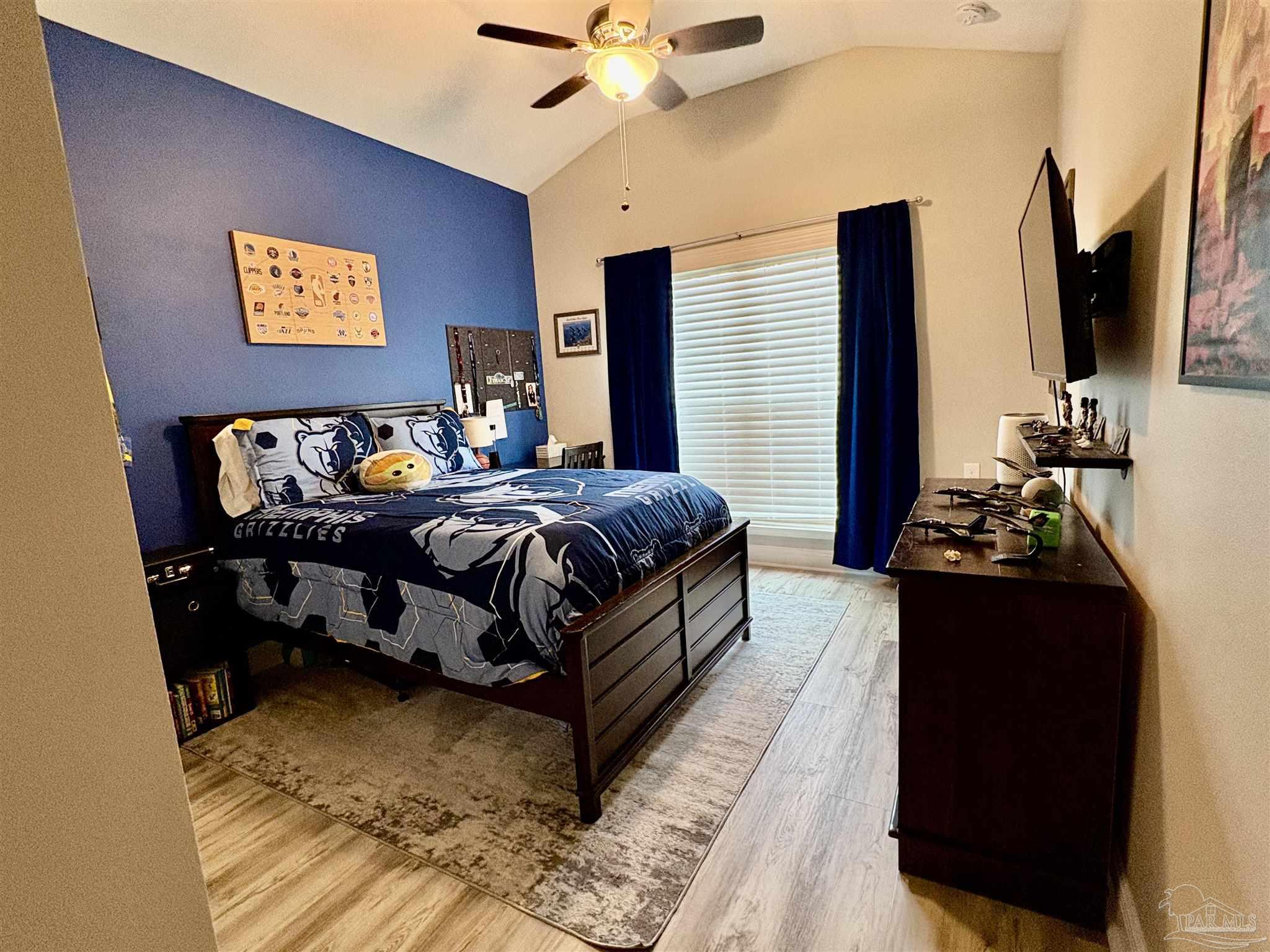 1700 Kahuna Way Cantonment, FL 32533 - Photo 25 of 34 a bedroom with bed and glass door