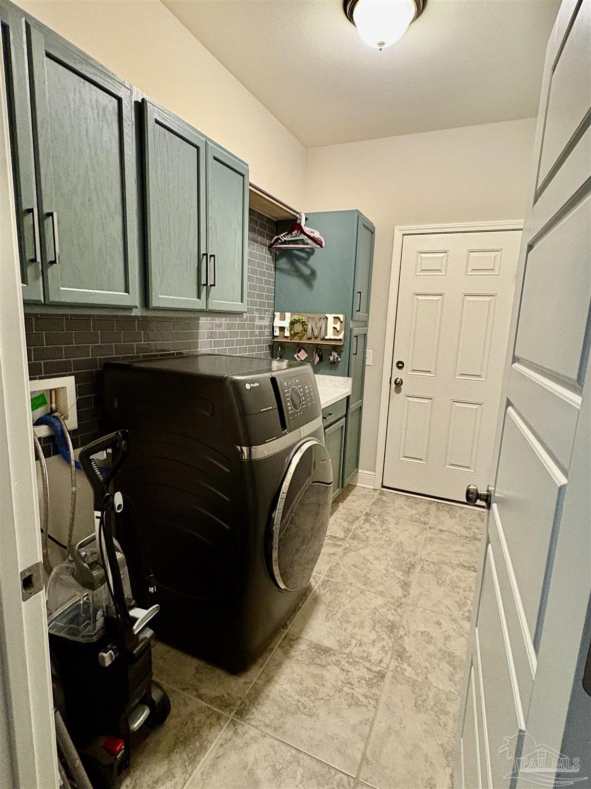 1700 Kahuna Way Cantonment, FL 32533 - Photo 29 of 34 a utility room with multiple dryer and washer