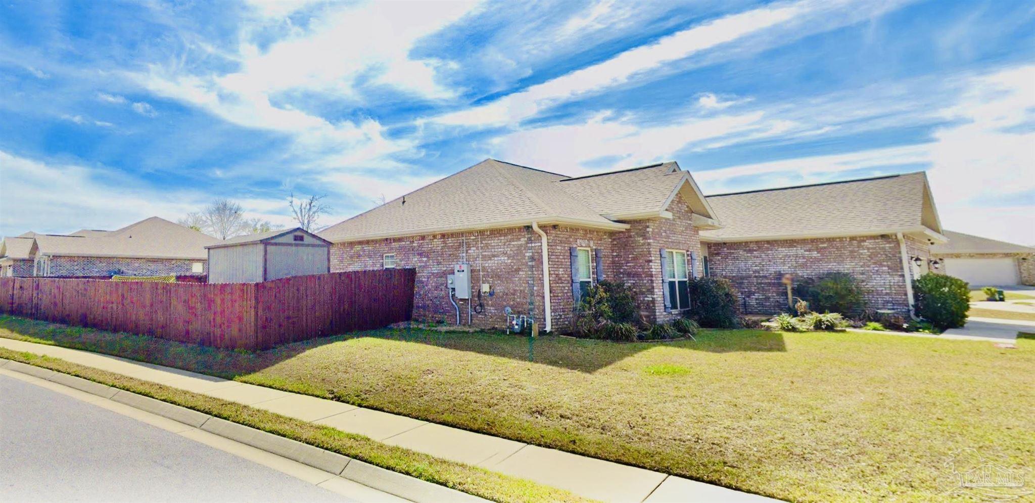 1700 Kahuna Way Cantonment, FL 32533 - Photo 3 of 34 a view of an house with backyard space and balcony