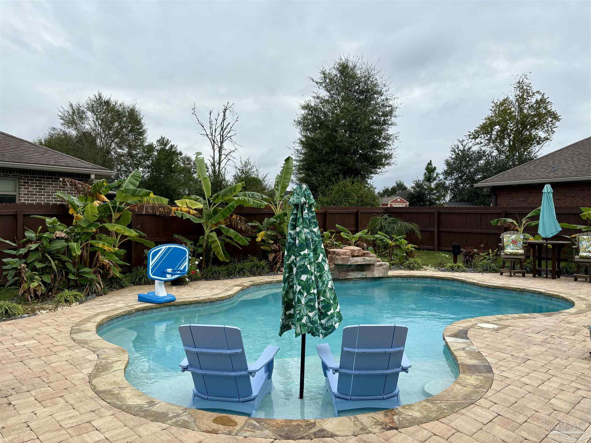 1700 Kahuna Way Cantonment, FL 32533 - Photo 34 of 34 a front view of a house with garden