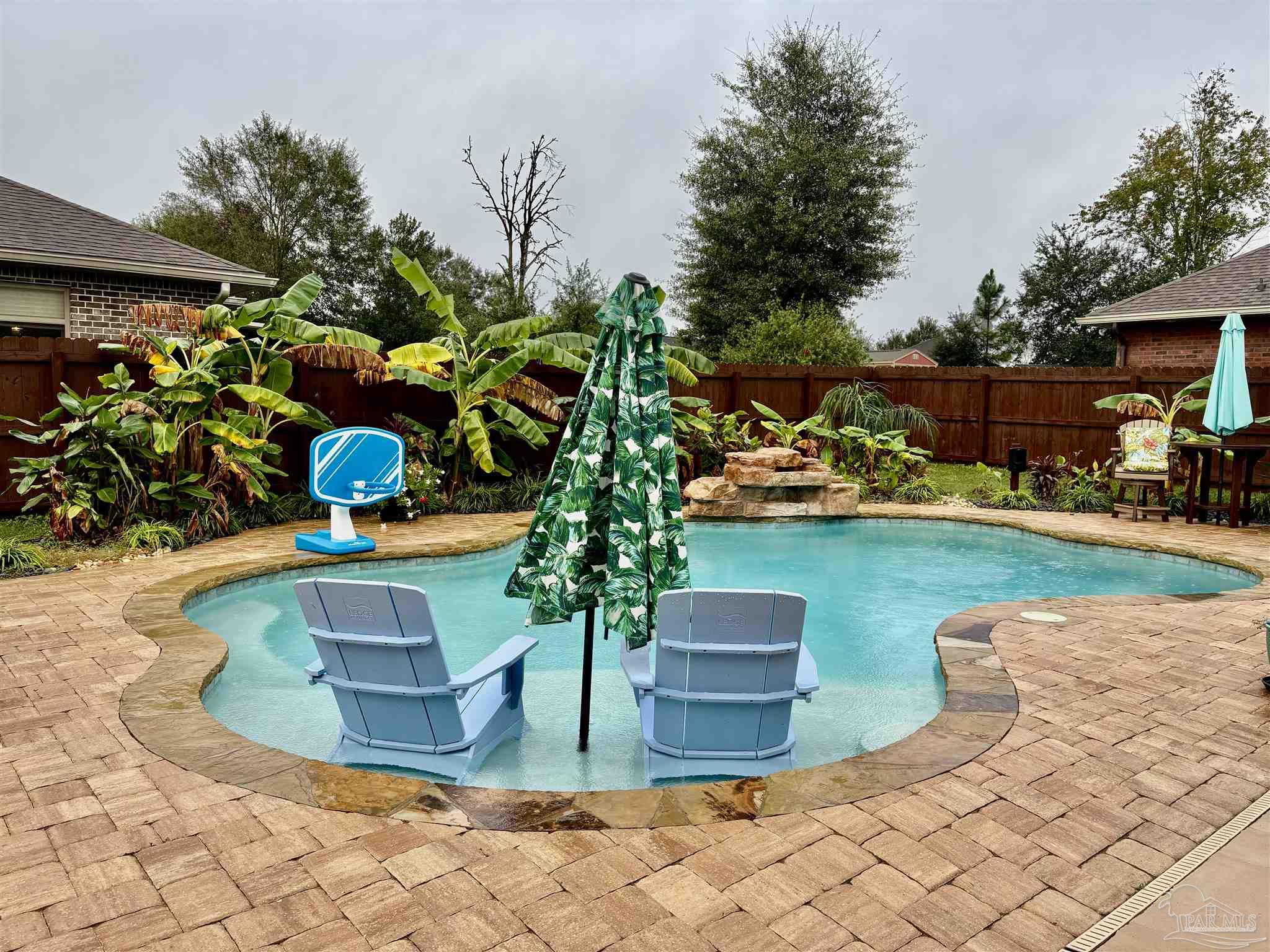 1700 Kahuna Way Cantonment, FL 32533 - Photo 4 of 34 a view of a swimming pool with sitting area