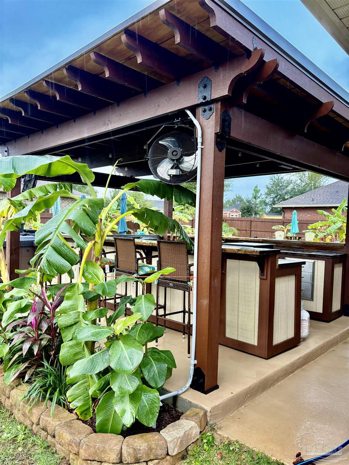 1700 Kahuna Way Cantonment, FL 32533 - Photo 5 of 34 a view of a potted plants with large windows