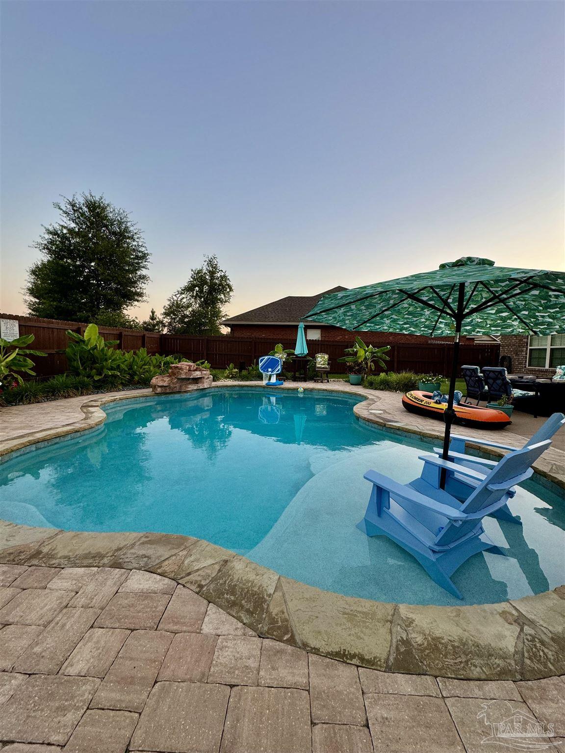 1700 Kahuna Way Cantonment, FL 32533 - Photo 8 of 34 a view of a lake with a park