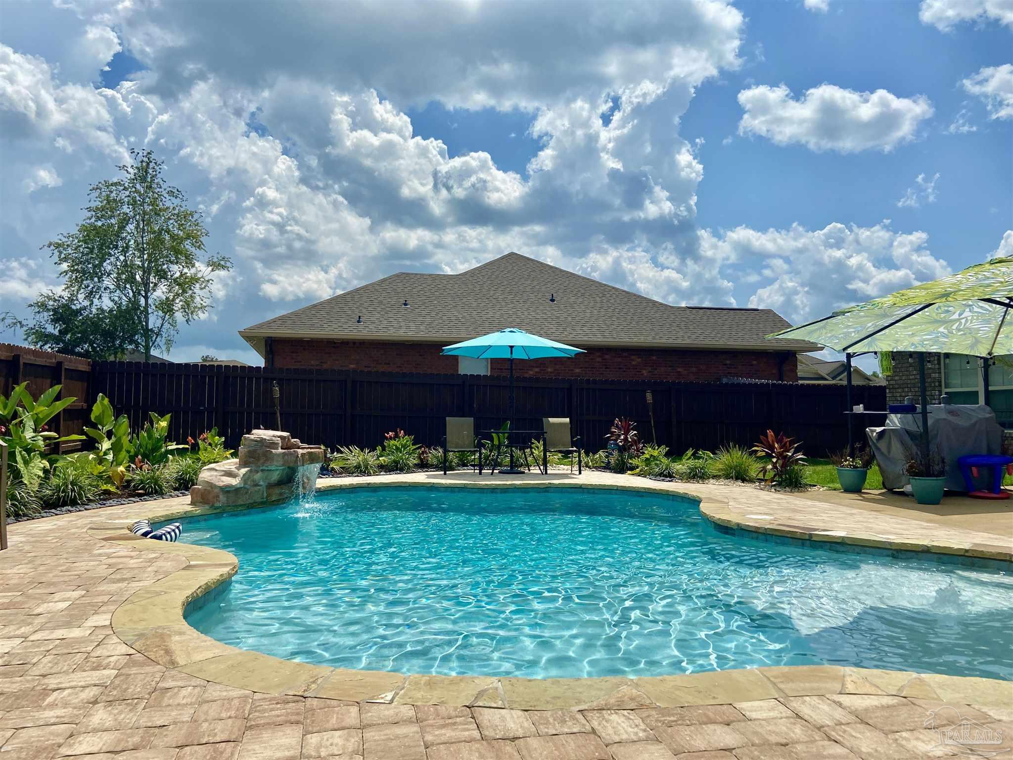 1700 Kahuna Way Cantonment, FL 32533 - Photo 10 of 34 a front view of a house with a yard