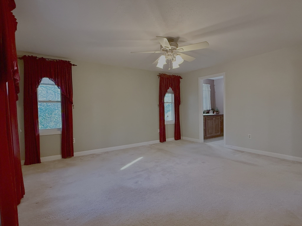 3 Tanager Road Goffstown, NH 03045 - Photo 13 of 35 a view of an empty room with a window