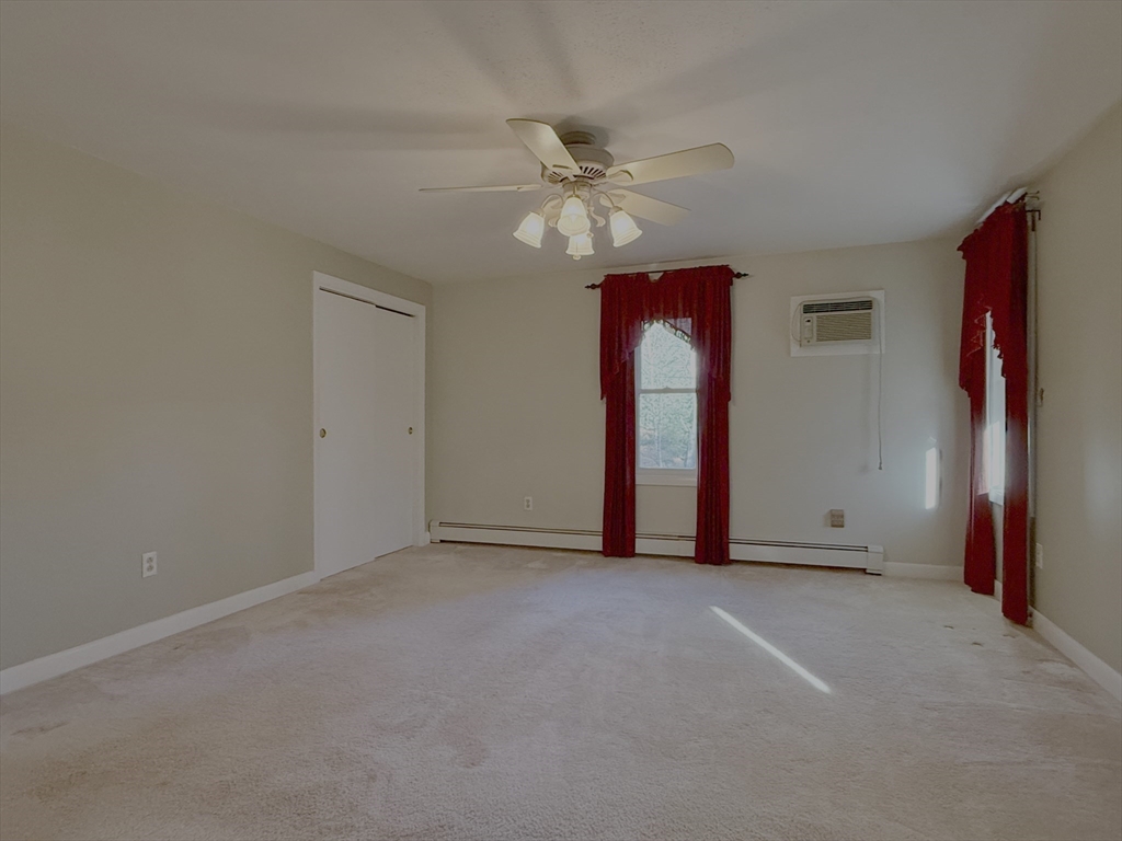 3 Tanager Road Goffstown, NH 03045 - Photo 15 of 35 a view of an empty room with window and chandelier fan