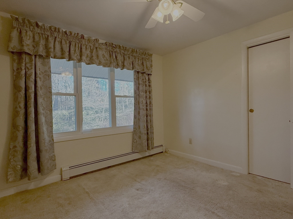 3 Tanager Road Goffstown, NH 03045 - Photo 18 of 35 an empty room with windows