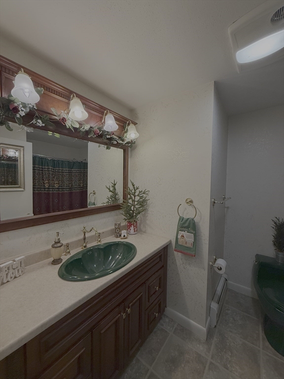 3 Tanager Road Goffstown, NH 03045 - Photo 23 of 35 a bathroom with a sink and a mirror