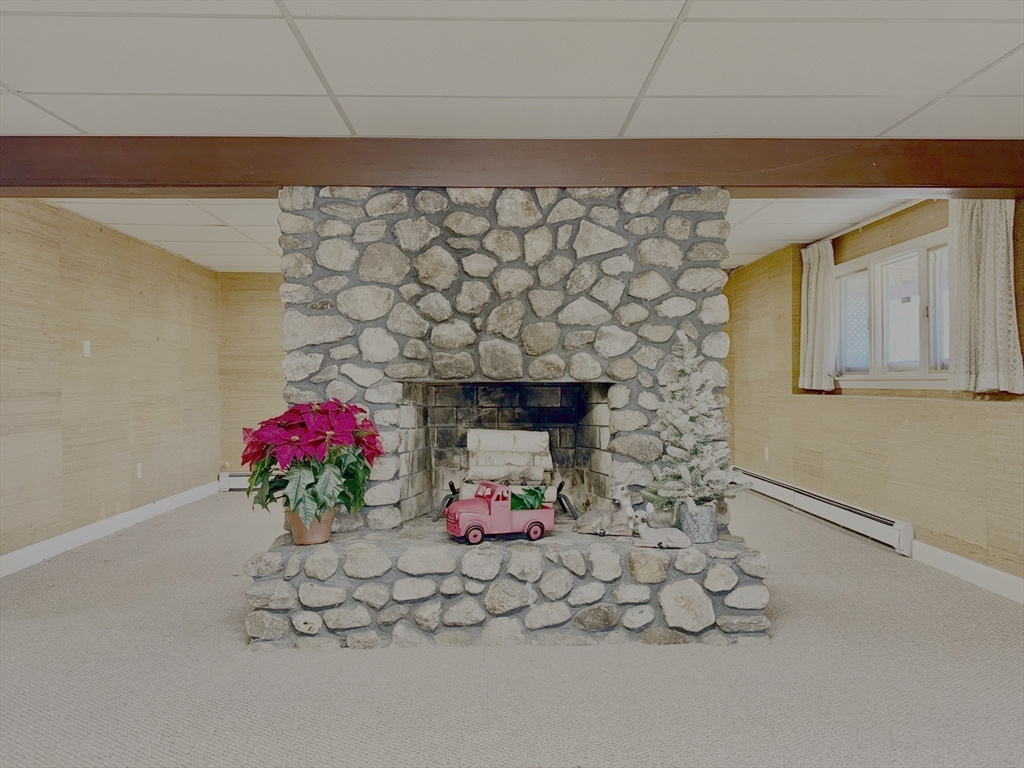 3 Tanager Road Goffstown, NH 03045 - Photo 29 of 35 a vase of flowers sitting on a floor