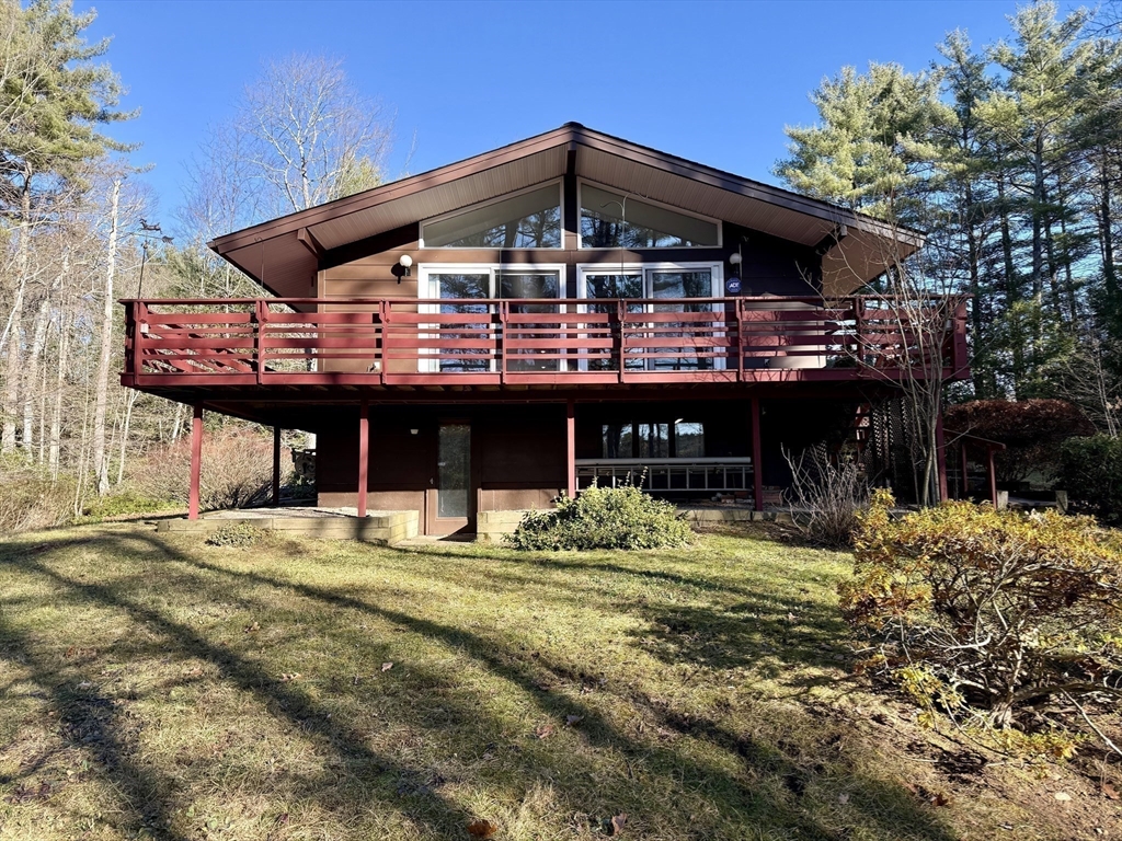 3 Tanager Road Goffstown, NH 03045 - Photo 32 of 35 a front view of a house with a garden