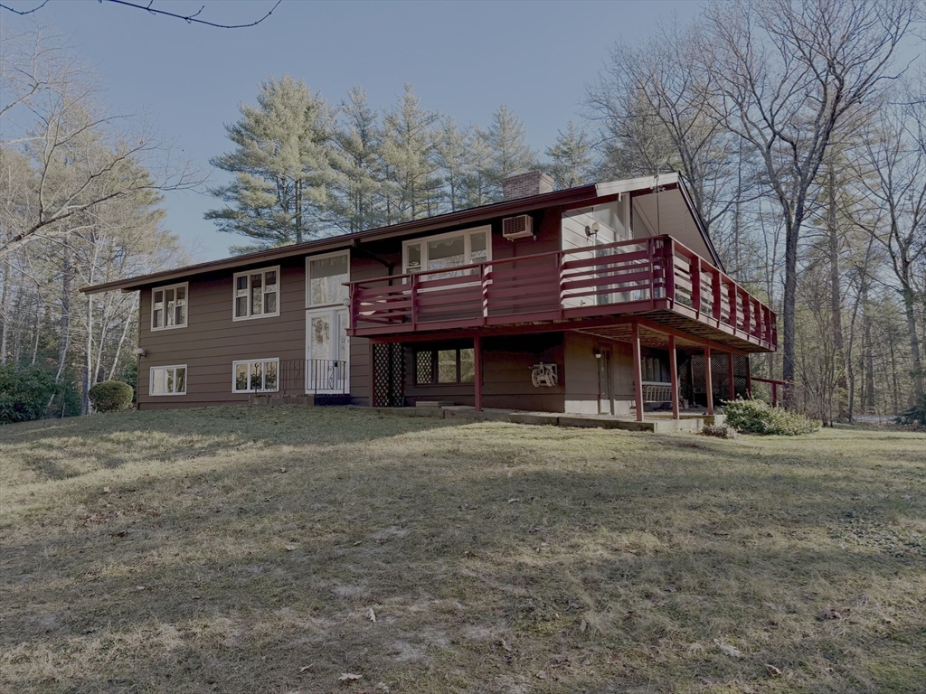 3 Tanager Road Goffstown, NH 03045 - Photo 34 of 35 a front view of a house with a garden