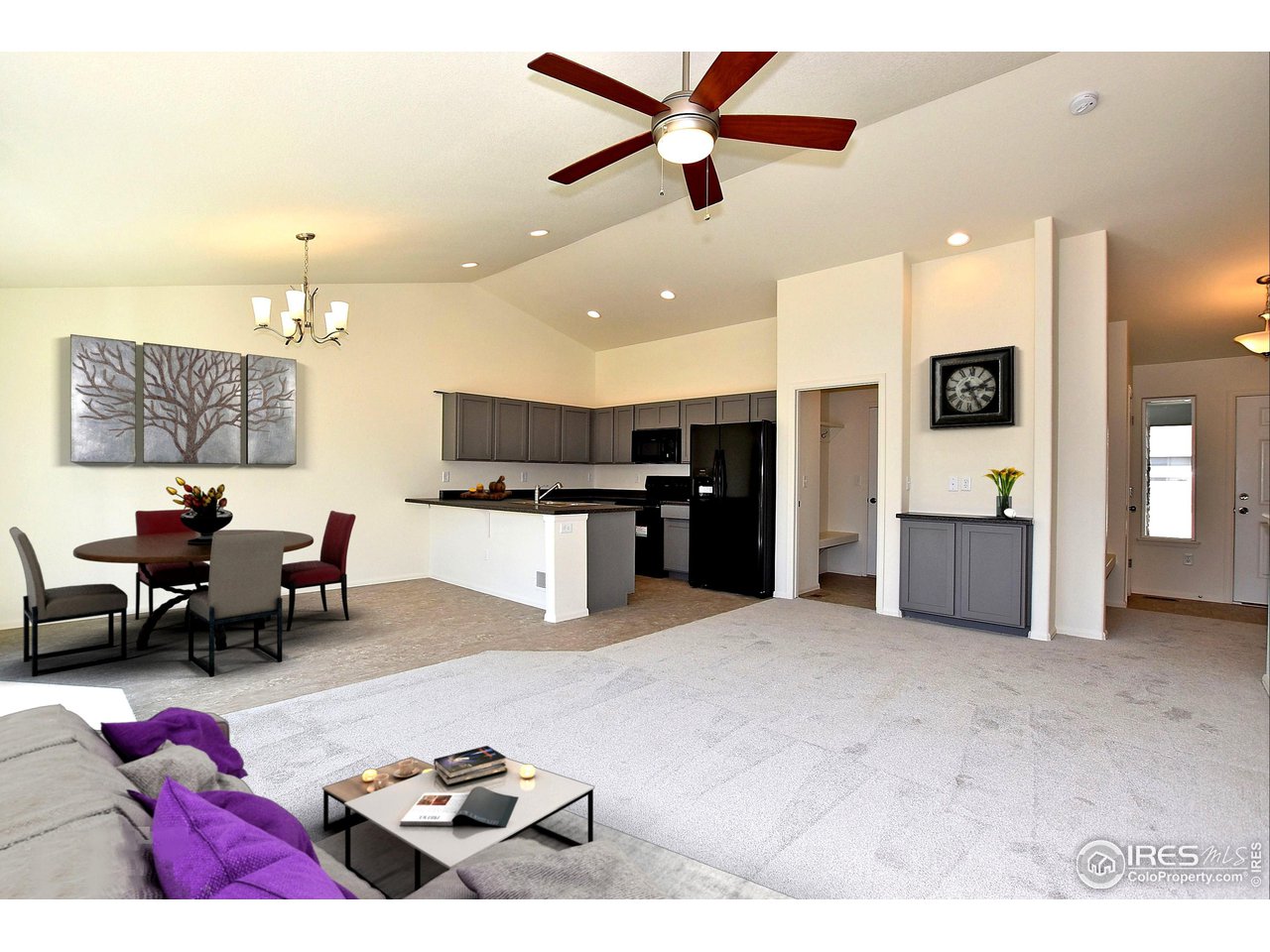 2335 Sublime Drive Windsor, CO 80550 - Photo 2 of 39 a living room with furniture and kitchen view