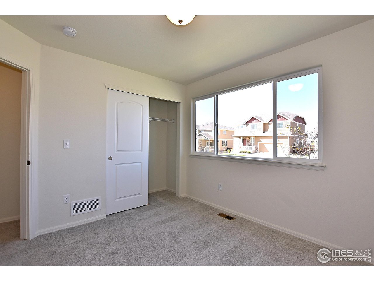 2335 Sublime Drive Windsor, CO 80550 - Photo 32 of 39 a view of an empty room with a window