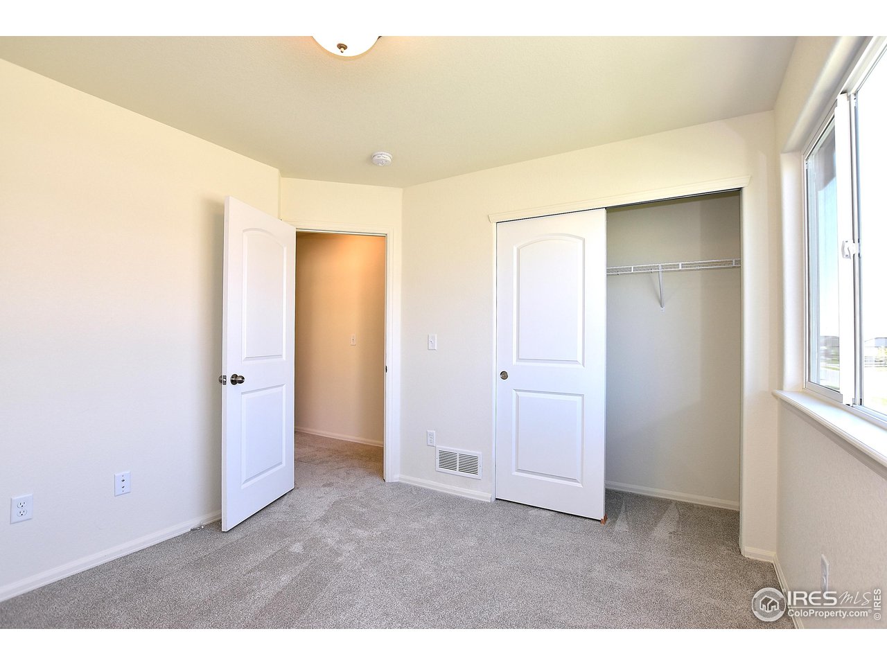 2335 Sublime Drive Windsor, CO 80550 - Photo 33 of 39 a big room with closet and wooden floor