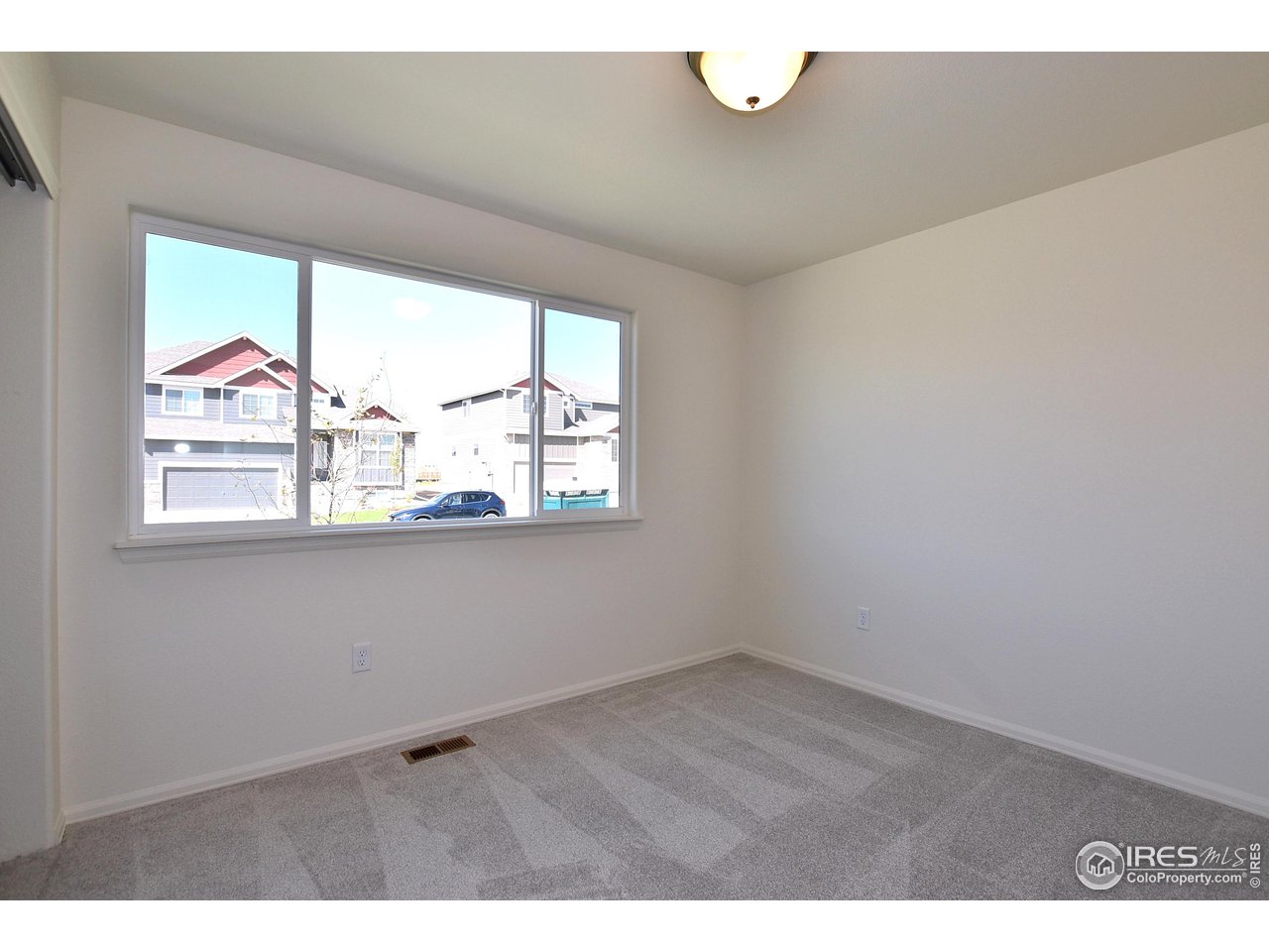 2335 Sublime Drive Windsor, CO 80550 - Photo 35 of 39 a view of an empty room with a window