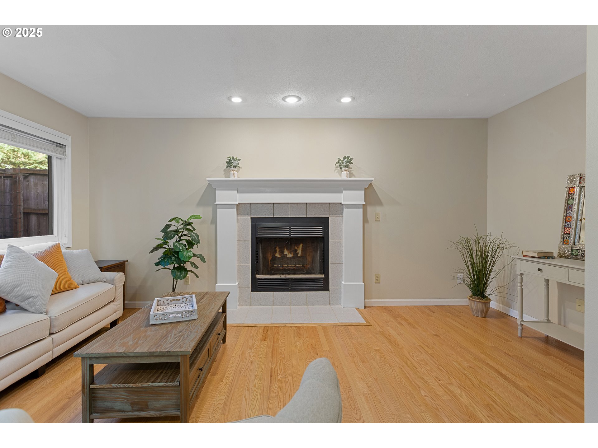 9125 Southwest Davies Road Beaverton, OR 97008 - Photo 15 of 44 a living room with furniture and a fireplace