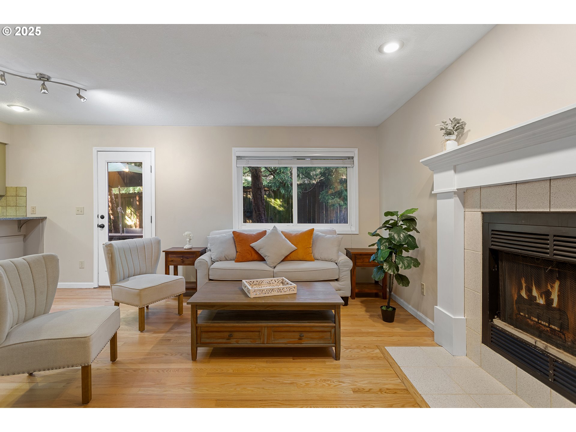 9125 Southwest Davies Road Beaverton, OR 97008 - Photo 16 of 44 a living room with furniture and a fireplace
