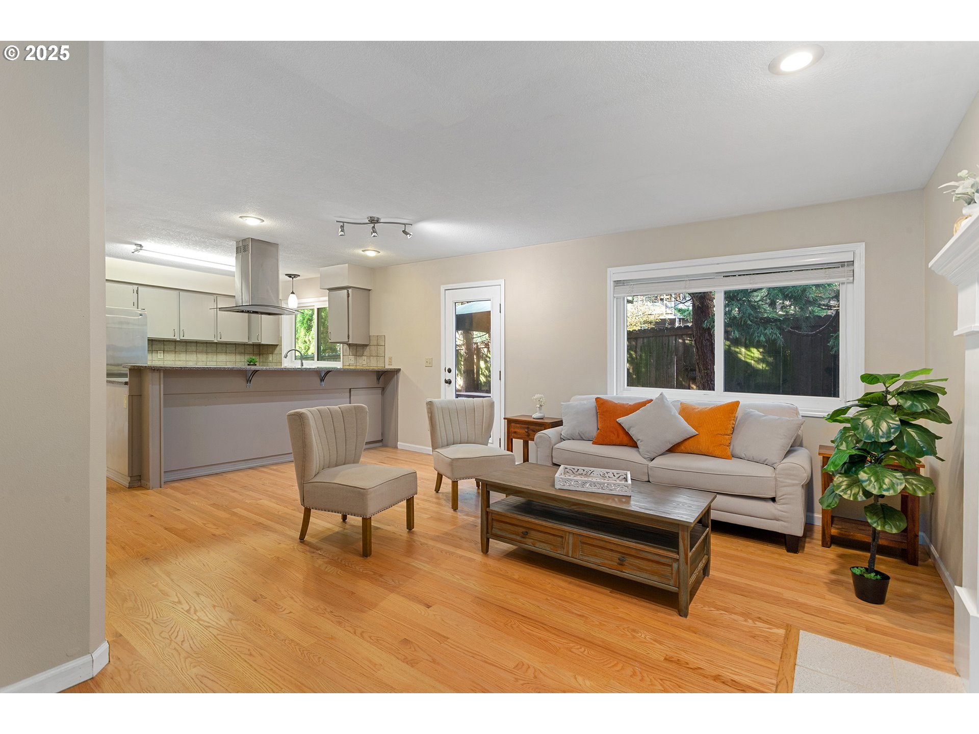 9125 Southwest Davies Road Beaverton, OR 97008 - Photo 17 of 44 a living room with furniture and a table