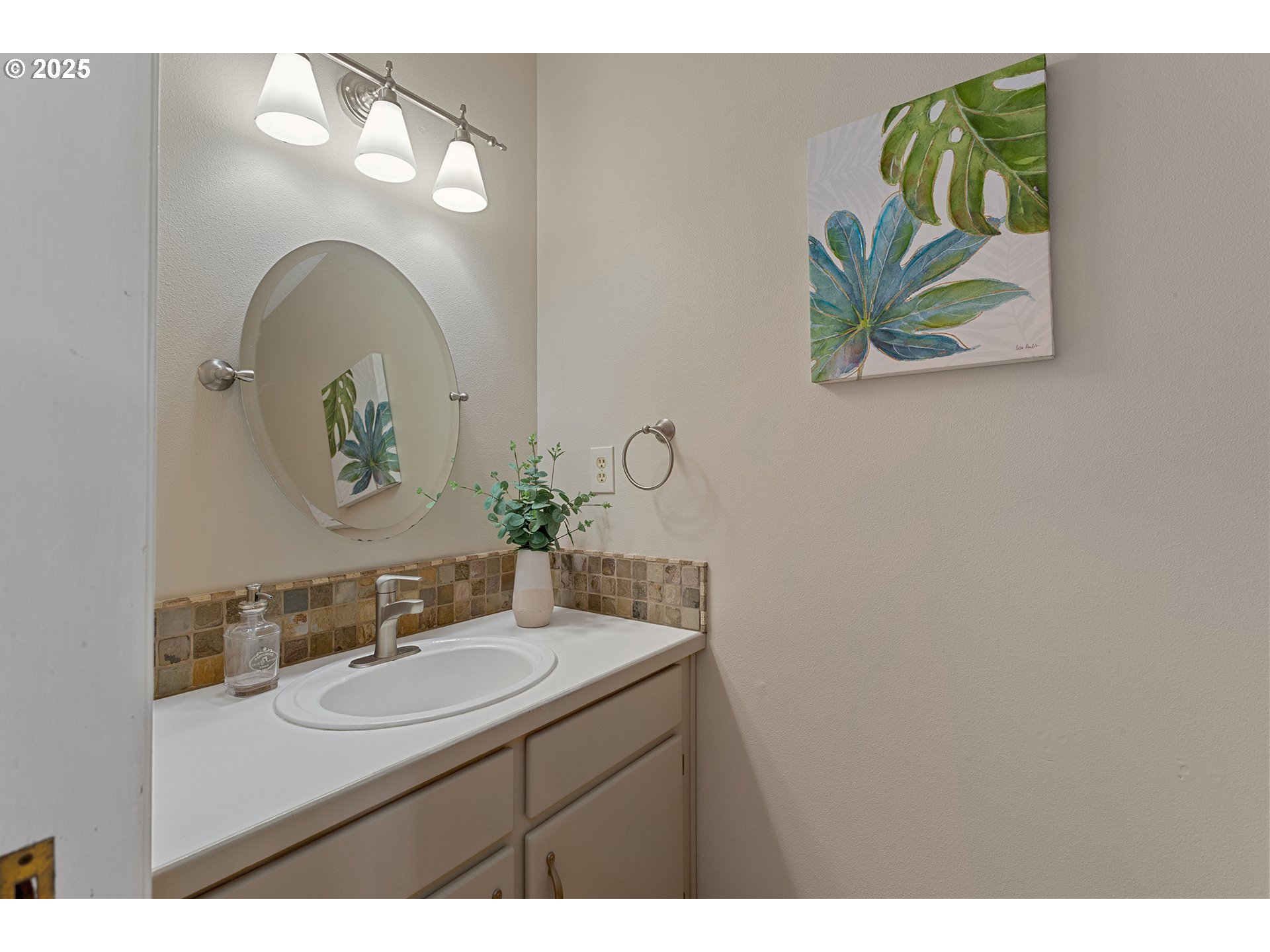9125 Southwest Davies Road Beaverton, OR 97008 - Photo 21 of 44 a bathroom with a sink and a mirror
