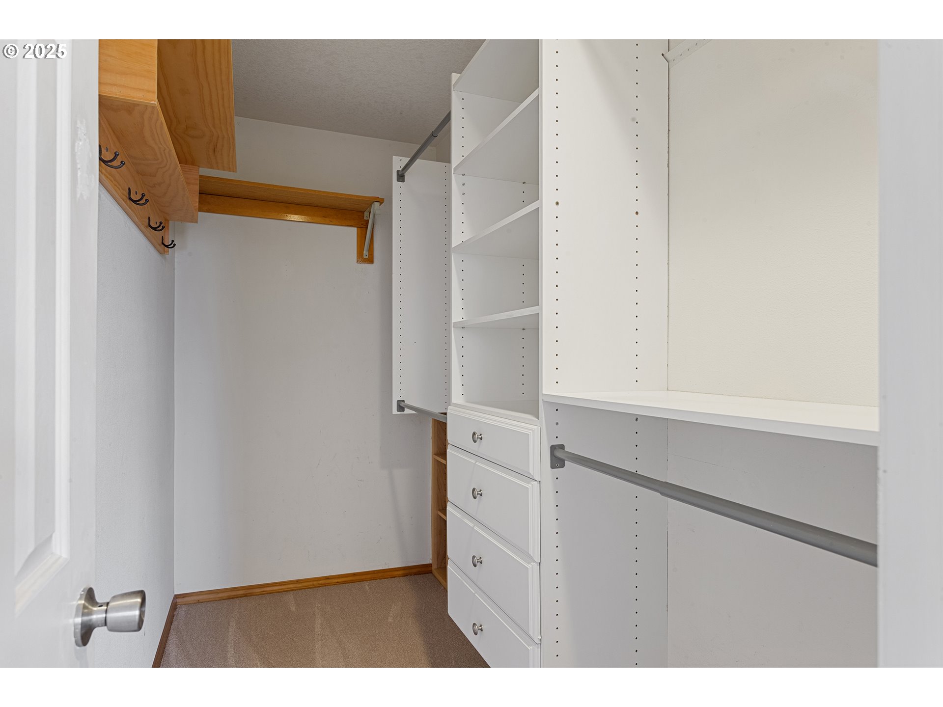 9125 Southwest Davies Road Beaverton, OR 97008 - Photo 25 of 44 a view of walk in closet with empty racks