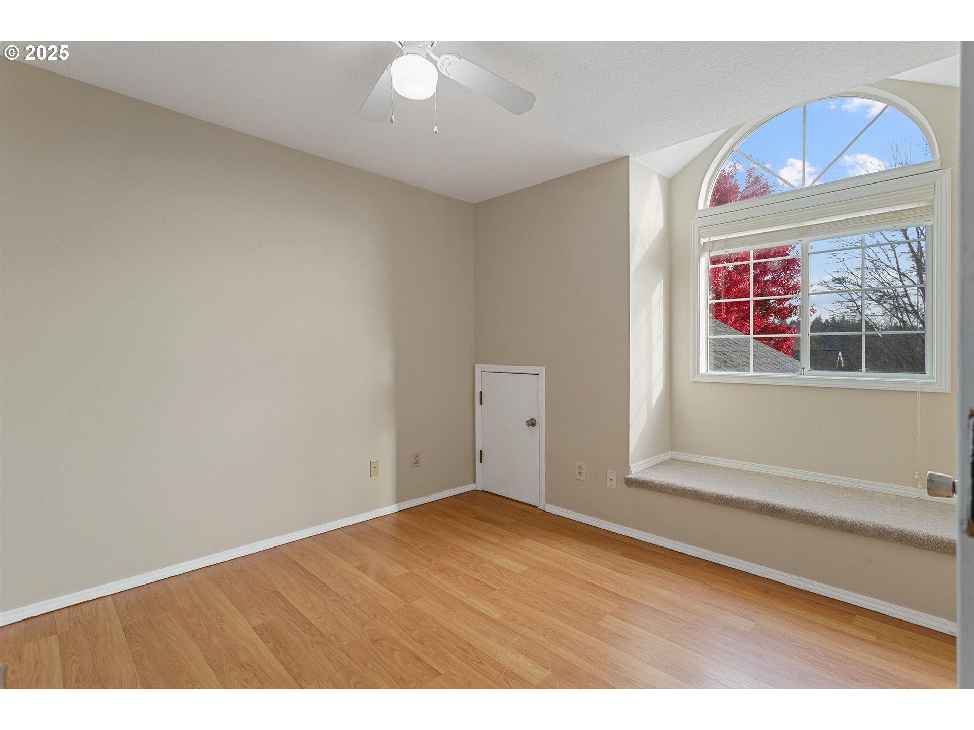 9125 Southwest Davies Road Beaverton, OR 97008 - Photo 29 of 44 a view of an empty room with wooden floor and a window