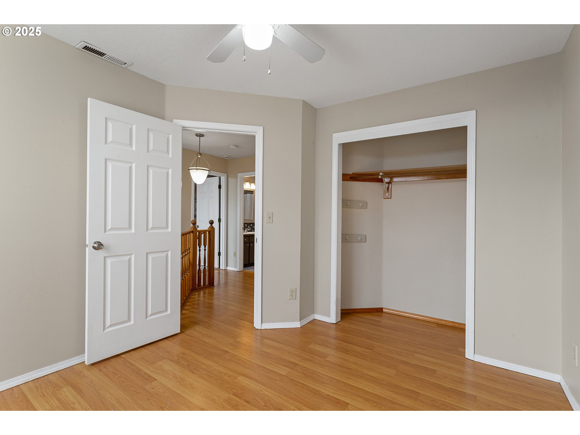 9125 Southwest Davies Road Beaverton, OR 97008 - Photo 30 of 44 a view of an empty room with wooden floor