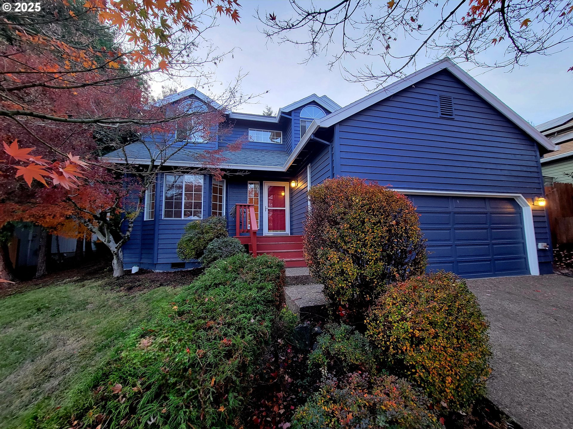 9125 Southwest Davies Road Beaverton, OR 97008 - Photo 3 of 44 a view of a house with a large window and a yard