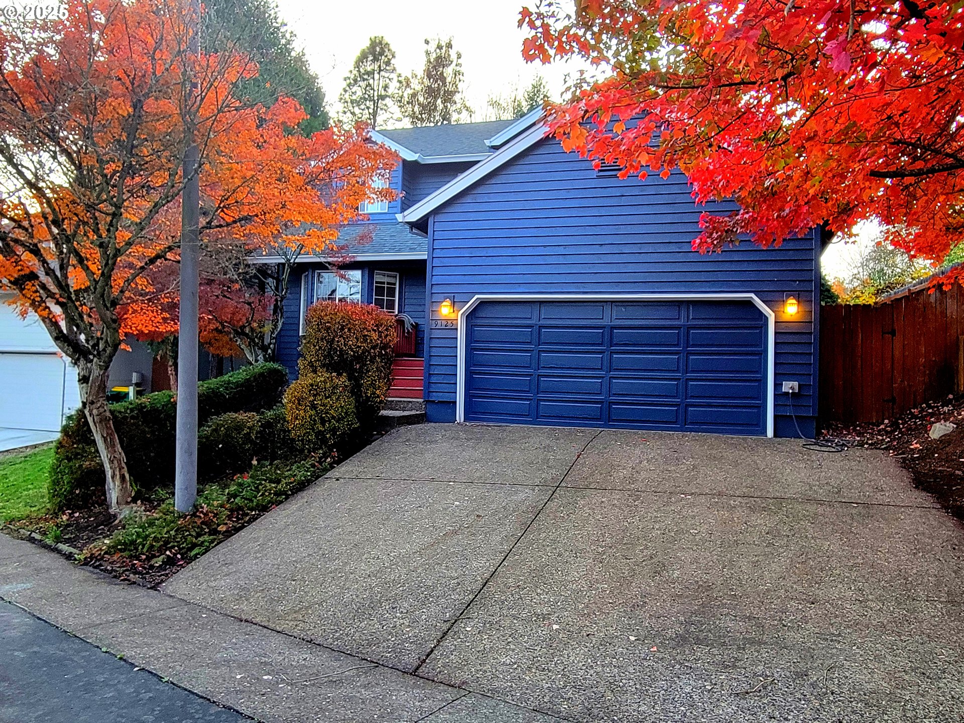 9125 Southwest Davies Road Beaverton, OR 97008 - Photo 4 of 44 a front view of a house with a yard