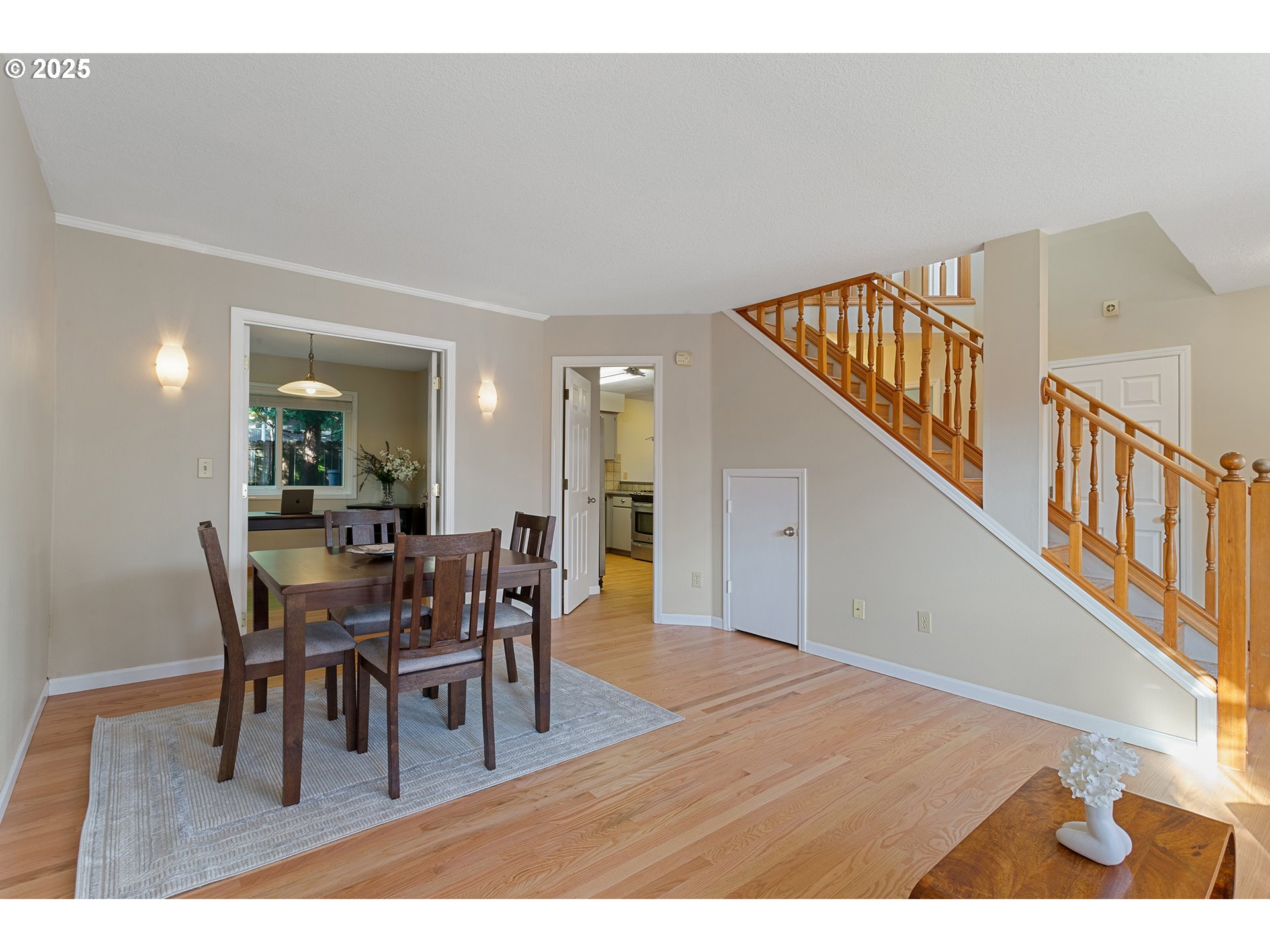 9125 Southwest Davies Road Beaverton, OR 97008 - Photo 7 of 44 a view of a dining room with furniture and wooden floor