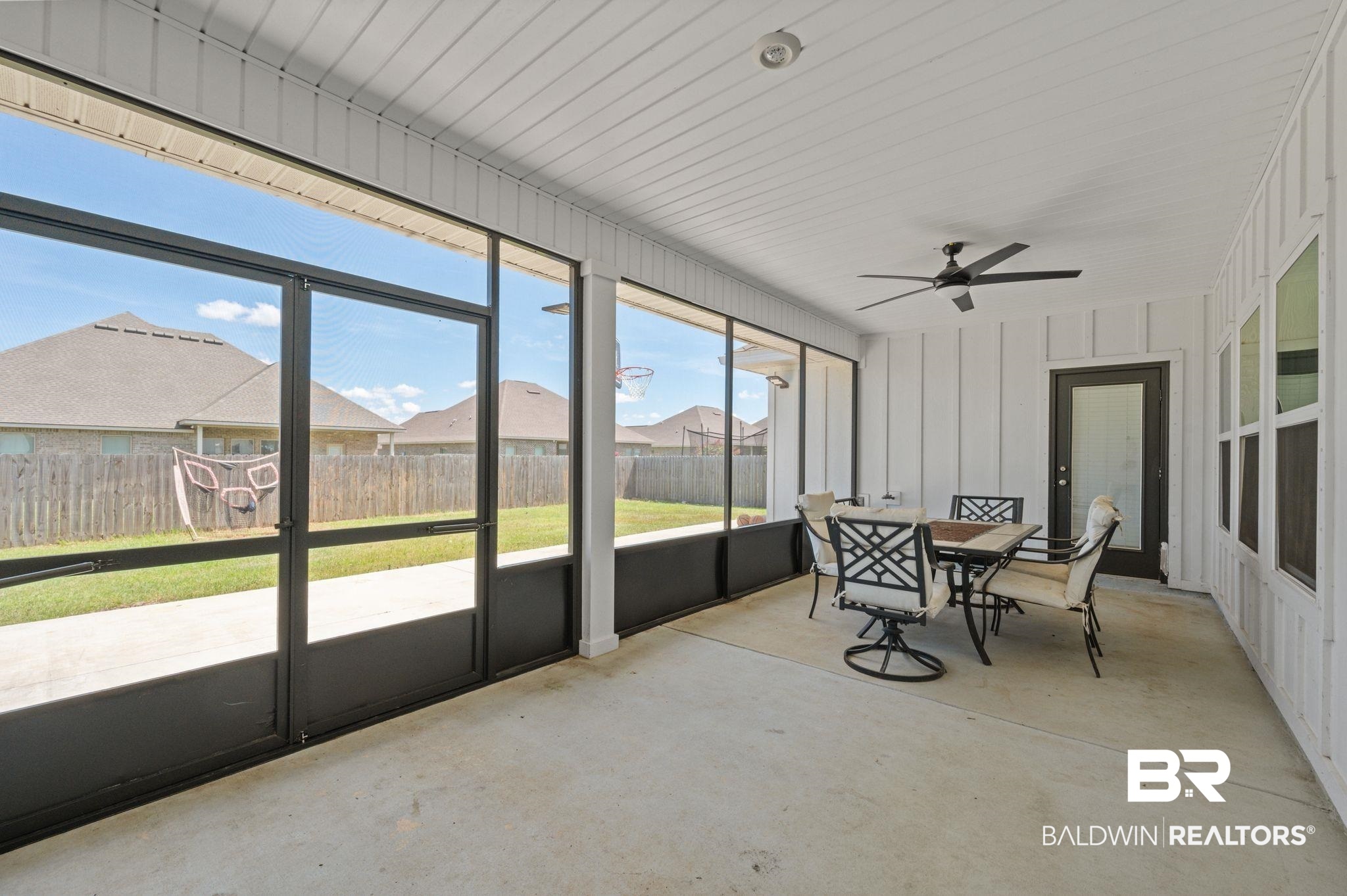 10169 Dunleith Loop Daphne, AL 36526 - Photo 11 of 40 Sunroom featuring ceiling fan and outdoor dining area