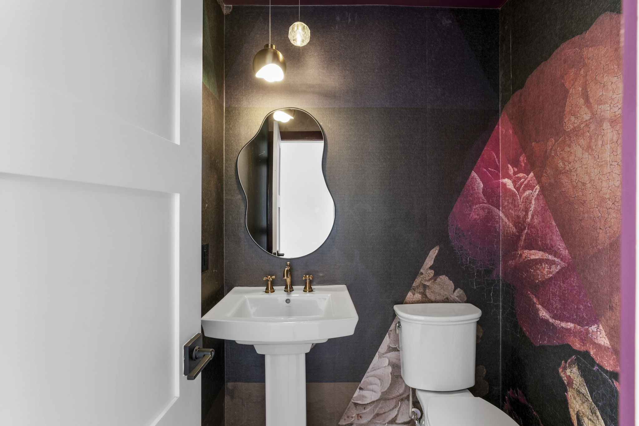 701 Furlong Drive Austin, TX 78746 - Photo 14 of 40 a bathroom with a toilet sink and mirror