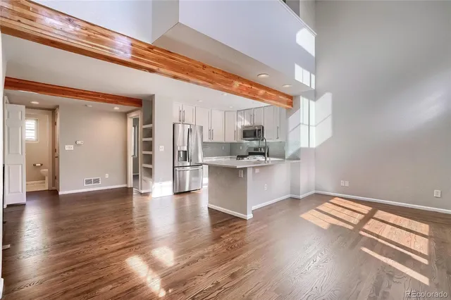 a bathroom with a sink toilet vanity and shower