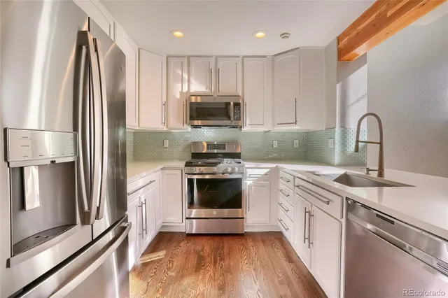 a bathroom with a sink mirror and toilet