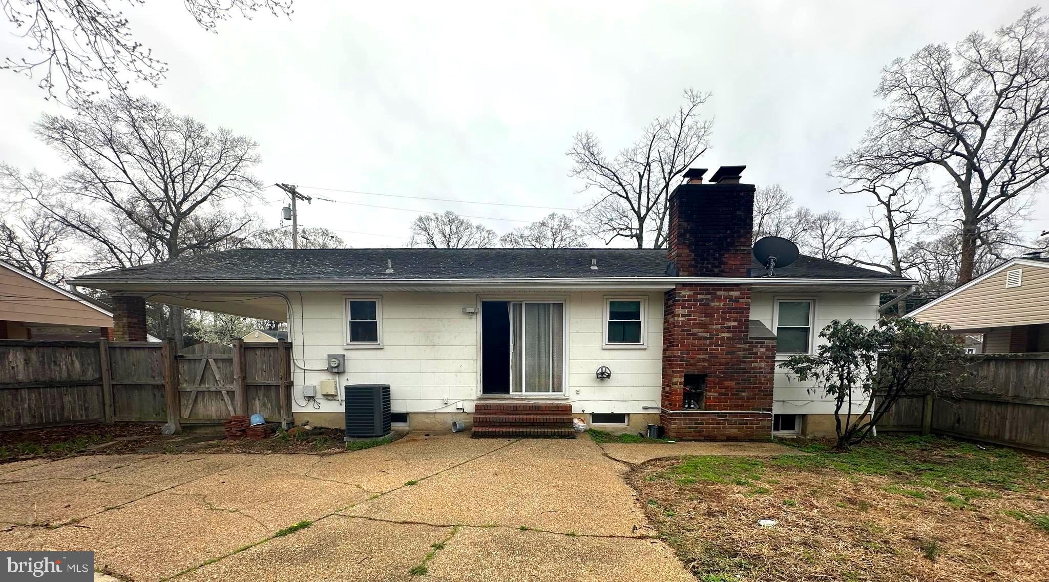 523 Sunset Knoll Road Pasadena, MD 21122 - Photo 4 of 5 a view of a house with a patio and a yard