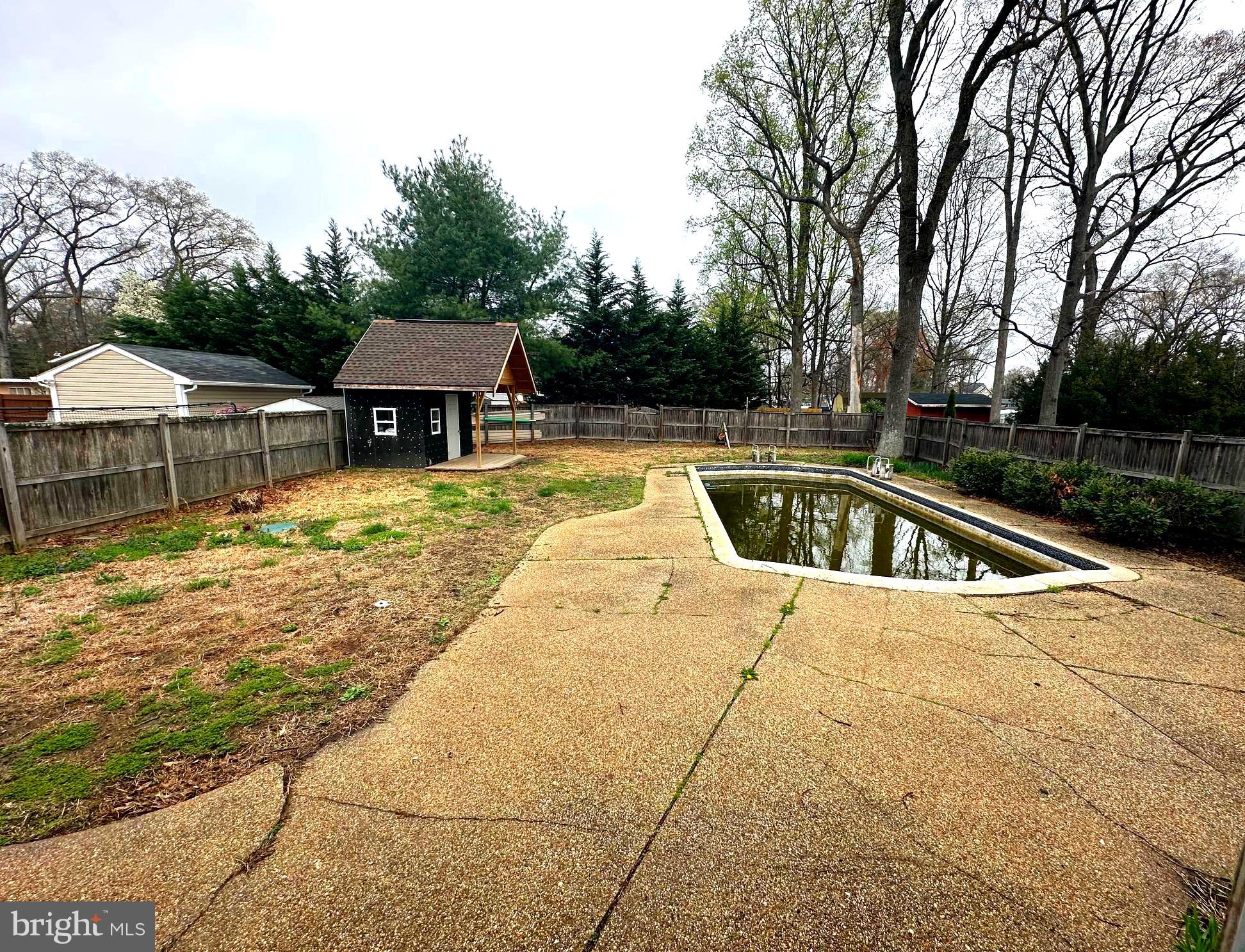 523 Sunset Knoll Road Pasadena, MD 21122 - Photo 5 of 5 a view of a house with pool and sitting area