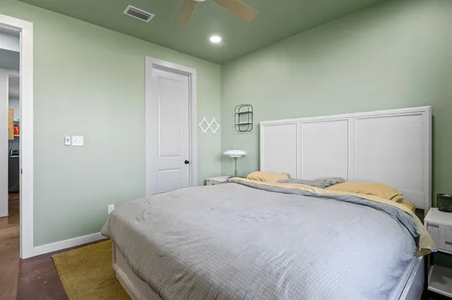 a bedroom with a bed and a table