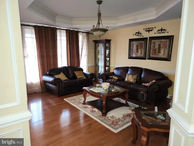 a living room with furniture rug and window