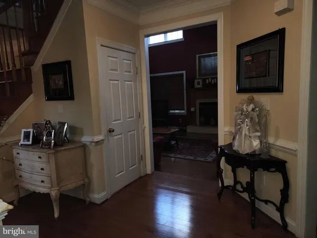 a workspace with wooden floor and windows