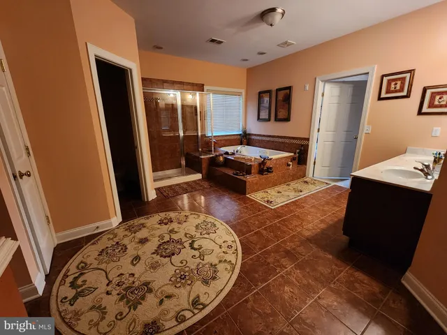 a living room with a rug and a table