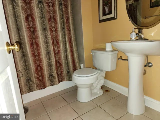 a bathroom with a toilet and a sink