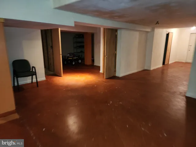 a view of a livingroom with furniture and a window