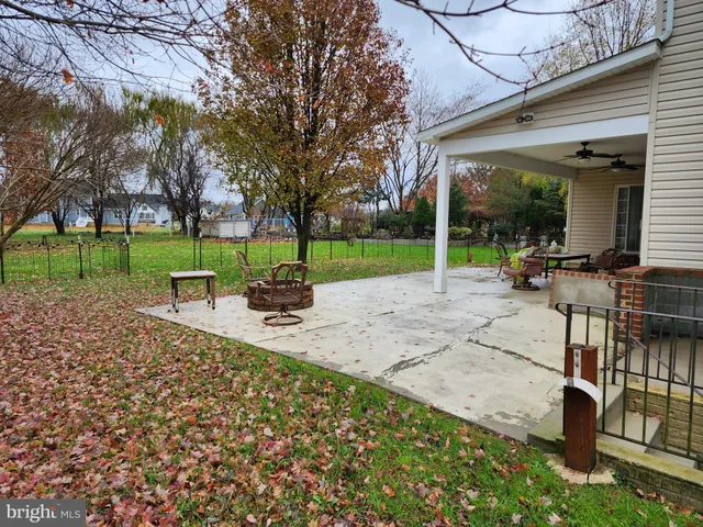 a view of a backyard with sitting area