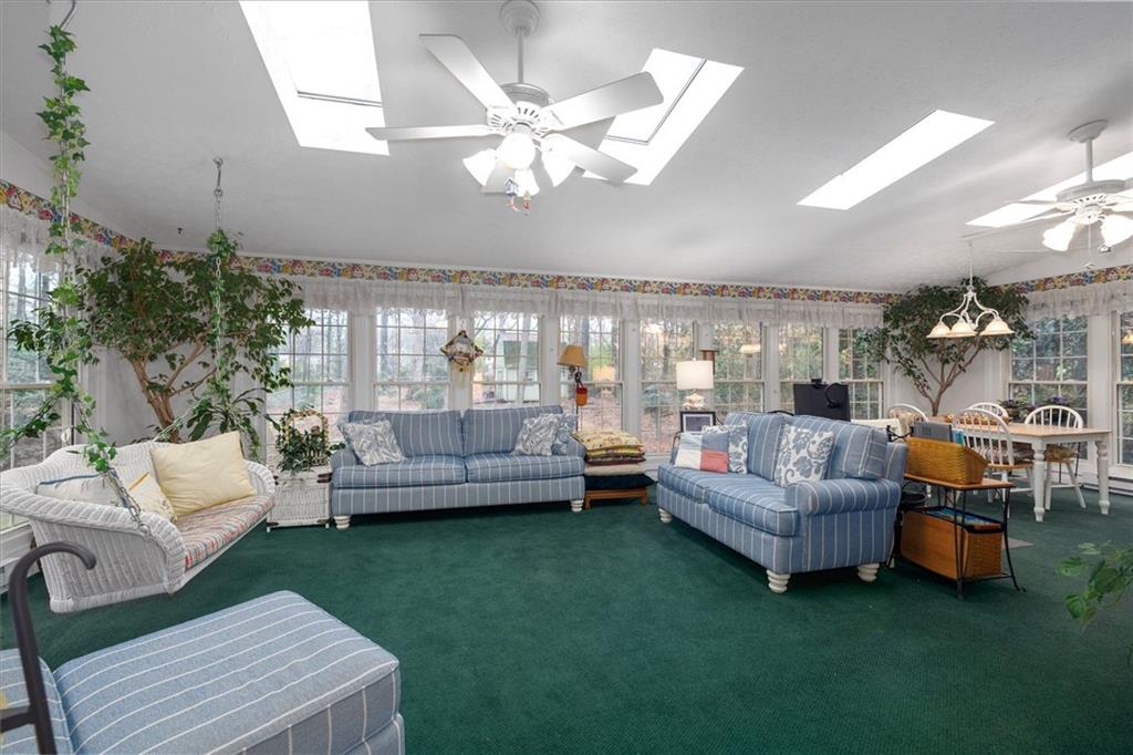 1942 Musket Court Smoke Rise, GA 30087 - Photo 20 of 54 a living room with furniture and a large window