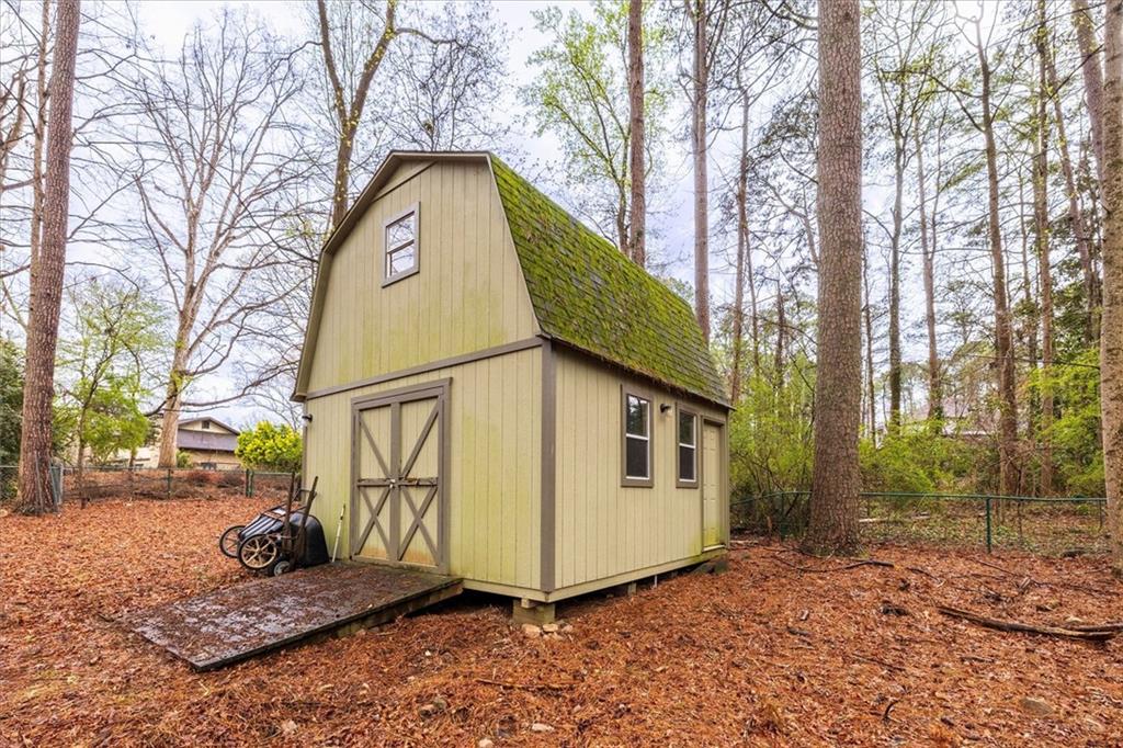 1942 Musket Court Smoke Rise, GA 30087 - Photo 47 of 54 a view of a tiny house with a yard