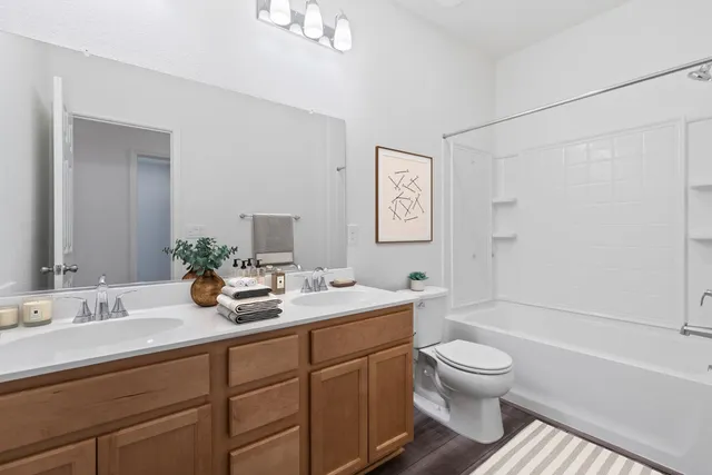 a bathroom with a toilet a sink and a bathtub