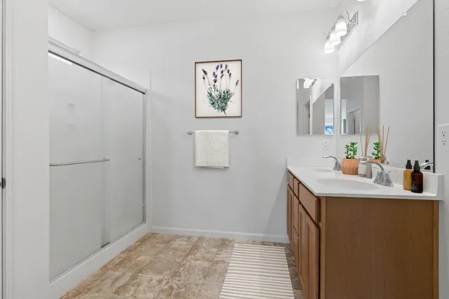 a room with a sink and a mirror